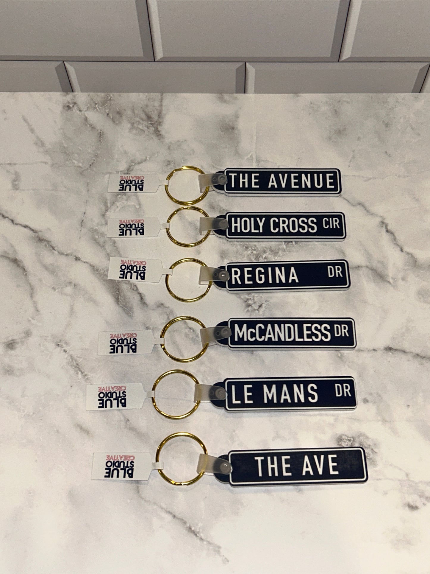 Saint Mary's College Keychains | The Avenue | The Ave | Le Mans Dr | Better in Blue Co.